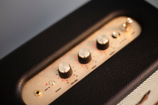 Vintage black and golden music amplifier volume knobs