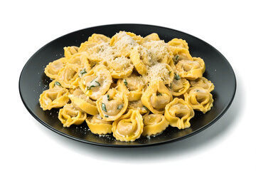 A serving of delicious tortelloni pasta on a black plate, sprinkled with parmesan cheese isolated on transparent background