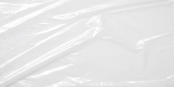 A closeup abstract of white plastic bag texture on a frozen snow background with cold blue winter sky patterns and fresh icy paper surface textures. Modern seamless grey background with liquid crystal