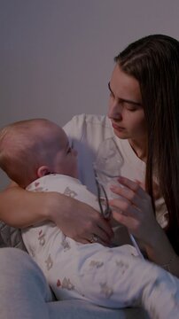 Mother soothing her baby during home nebulization treatment, showcasing emotional connection and care, camera pans to capture tender moments of comfort and support