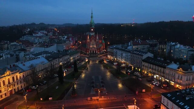 Evening drone view of St Joseph's Church and Podgorze Market Square in Krakow