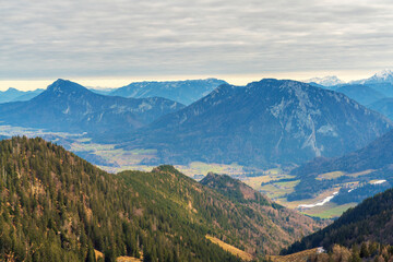 Chiemgau mountain valley landscape close to the Hochfelln peak during winter and autumn season