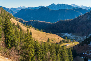 Chiemgau mountain valley landscape close to the Hochfelln peak during winter and autumn season