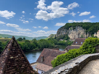 Picturesque La Roque Gageac in Dordogne showcasing Dordogne river, traditional houses and cliffs on sunny summer day