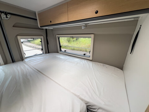 Campervan Double Bed with Windows Showing Street View in Sabadell, Spain