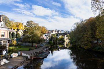 Knaresborough Viaduct reflected in the River Nidd on a calm autumn day, Yorkshire