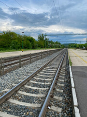 railway tracks at empty train station platform