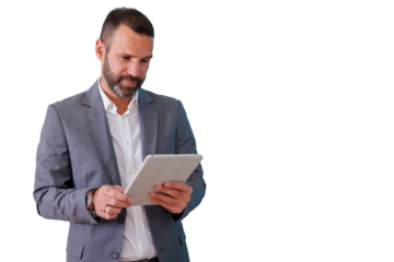 Business man in suit using digital tablet, browsing data and managing professional tasks with transparent background