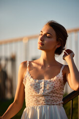 Slavic Woman in White Lace Dress at Sunset