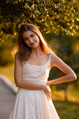 Slavic Woman in Sunlit Garden Wearing White Skirt
