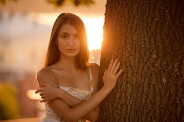 Slavic Woman in Lace Dress by Tree