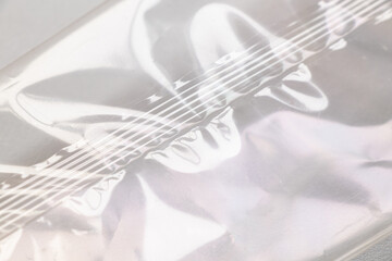 Transparent polyethylene packaging with a longitudinal seal, macro shot of smooth film, industrial packaging material for goods