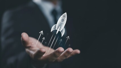 Businessman hand launching glowing rocket with upward trending arrows.