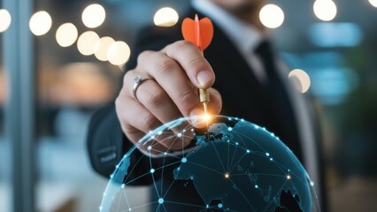Businessman aims dart at glowing digital global network target.