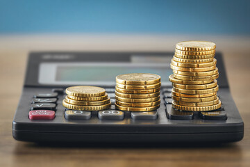 Coin stacks on calculator for financial growth