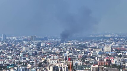 Fire incident in Bangkok city with visible flames and smoke rising
