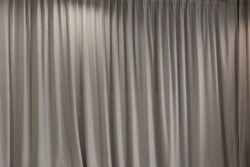 white curtain theater that dropped down as a straight line. Background for inserting text, empty spaces