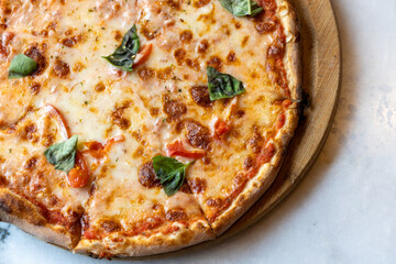 Close-Up of Italian Margherita Pizza with Fresh Basil Leaves
