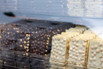  Close-Up of Hazelnut White and Dark Chocolates on Shop Counter