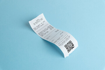 Curved paper receipt with qr code on blue background, representing digital payments, expense scanning, accounting workflow, and modern receipt management concepts