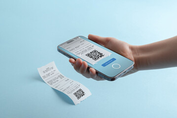 Smartphone scanning QR code from paper receipt, illustrating digital receipt storage, expense automation, mobile accounting, and paperless financial workflow