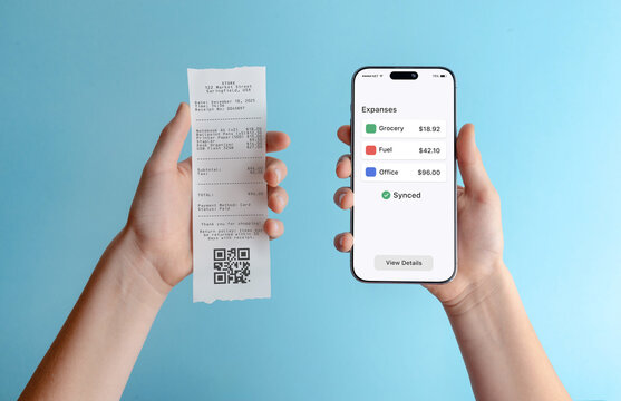 Smartphone displaying expenses overview next to paper receipt, illustrating expense tracking, bookkeeping, financial reporting, and business expense management - Powered by Adobe