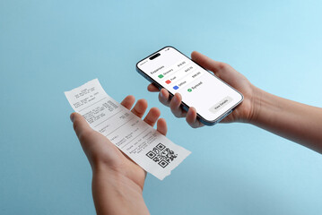 Smartphone displaying expenses overview while holding paper receipt, concept of expense tracking, digital accounting, mobile finance management, and paperless bookkeeping