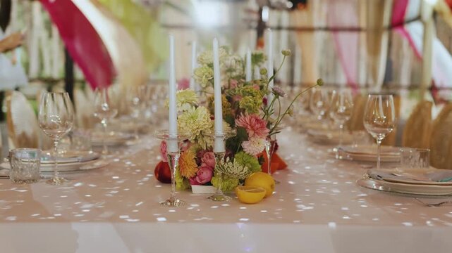 Chic wedding table setup, Sophisticated wedding table with candles and flowers, Refined wedding dining arrangement featuring crystalware and confetti