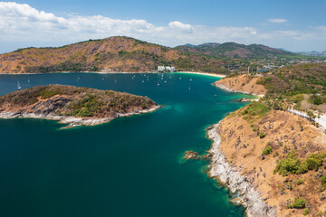 Obraz premium Aerial view from a drone of beautiful beach and coastline of Phuket island, Thailand.