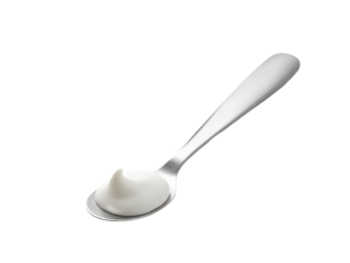 A close-up shot of a spoon with a white substance on it, possibly butter or cream