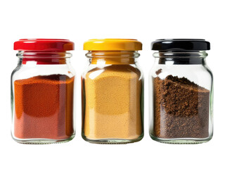 Three glass jars filled with different spices