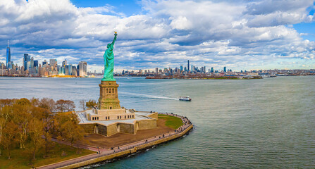 Panoramic aerial of Statue of Liberty on Liberty Island with Manhattan skyline © Alexey Fedorenko