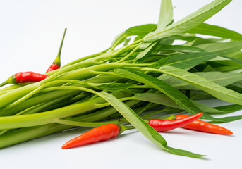 Fresh water spinach (kangkung) and red chili peppers isolated on white background