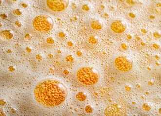 A close-up of bright orange oil or beer splashes, textured with natural waves, featuring smooth curves, tiny bubbles, and a soft, selective focus ideal for graphic design backgrounds