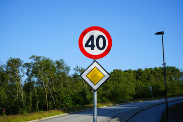 Main road traffic sign with 40 km/h speed limit. Close-up.
