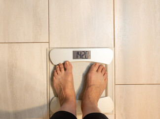 Senior Caucasian Female Standing on a Scale