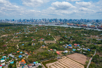 Fototapeta premium Aerial view from a drone of Bang Krachao island which is a green jungle oasis in the heart of Bangkok.
