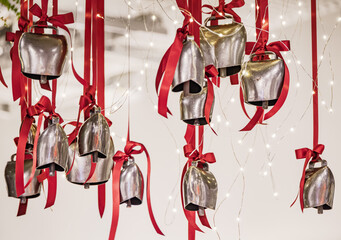 Silver cowbells with red ribbons, Christmas decorations in Zurich, Switzerland