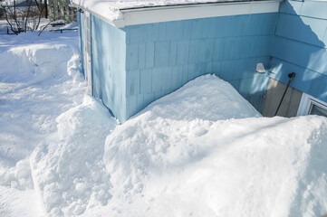close up on residential house with deep snow