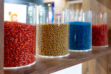 A set of oriental spices in a glass container, Turkish tubas in the kitchen, selective focus. Seed Coating Polymer for Seed Treatment Seed colorant . A product specially developed for film-forming wra