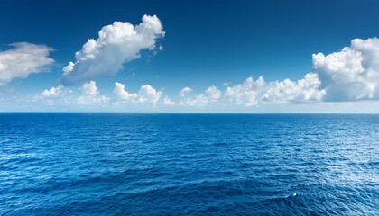 Obraz premium Blue Sea Horizon And White Clouds Backround