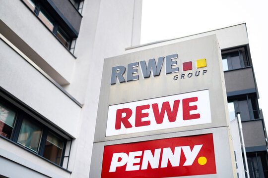 cologne, nrw, germany - 20 12 2025: a rewe group and penny sign
