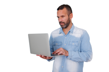 Man working on a laptop, standing and typing, engaged in remote work or online communication. Transparent background