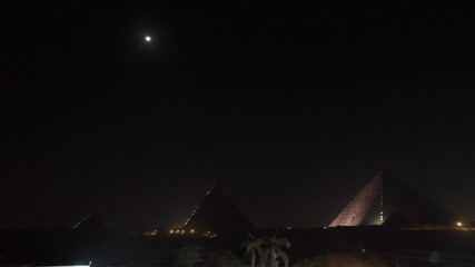 Cairo,Egypt - December 2, 2025:  Illumiated Khufu Pyramid and Khafre's Pyramid in Egypt