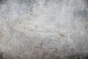 Grungy Concrete Wall Showing Cracks and Imperfections in a Neutral Toned Finish