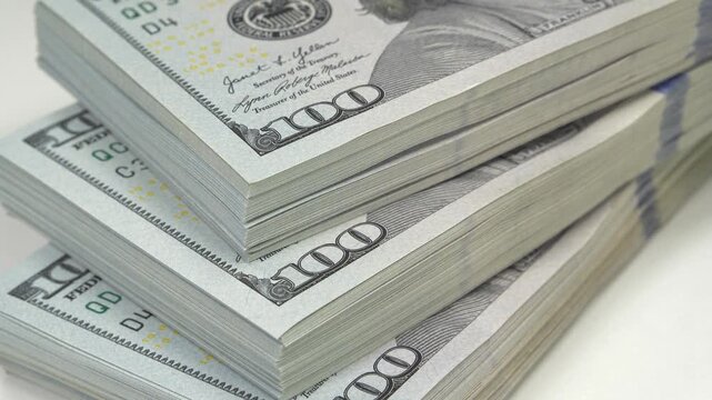 Thirty thousand of american dollars. Cash, finance, savings, wealth. Three packs of one hundred dollars. New hundred dollar bills, USD