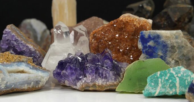 Semi Precious stones and minerals. Purple Amethysts, Quartz crystals, blue Lazurite, Agate, green Nephrite and Amazon stone, Gypsum, Citrine and golden Pyrite