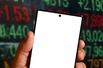 smartphone with blank screen and stock market behind