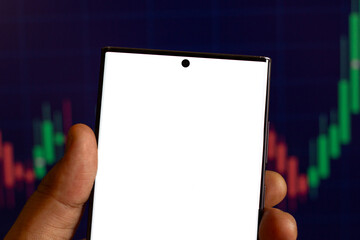 smartphone empty screen with candlestick chart behind