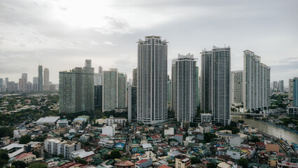 Concrete Giants Over a Patchwork Cityscape of Makati, Metro Manila, Philippines © Gids Stories